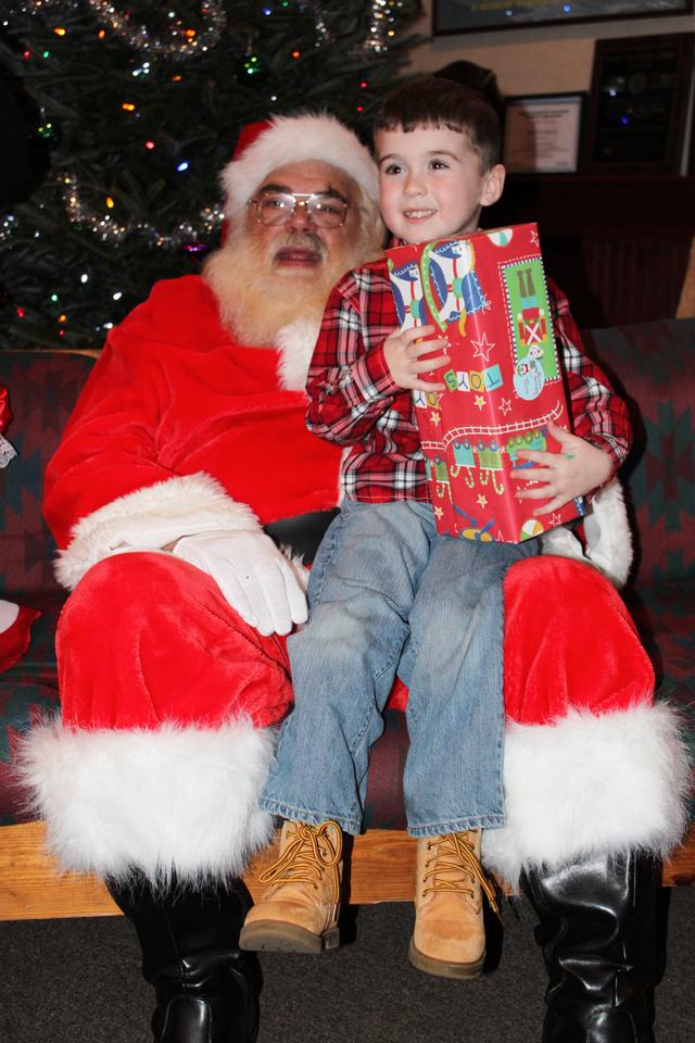 Children's Christmas Party at 8-100. 12-9-2012. Santa pays a visit . Photo by Vincent P. Tuzzolino